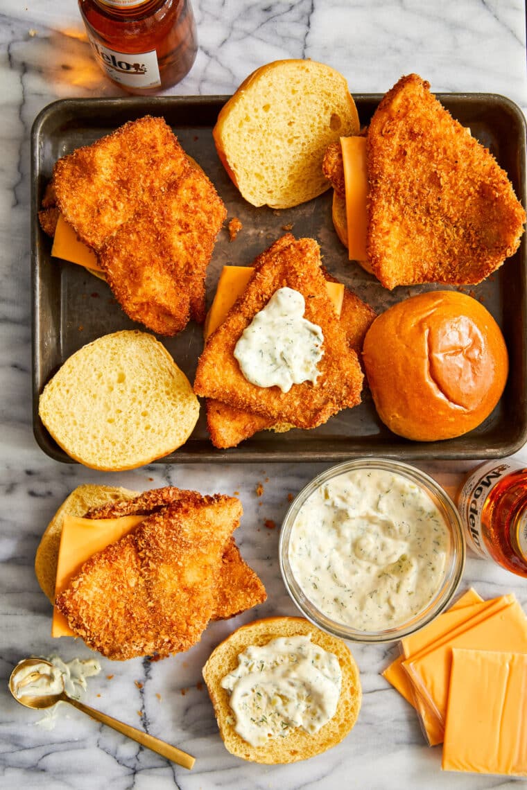 Crispy Fish Sandwiches - Oh-so-crisp fish sandwiches with melted cheese, soft brioche buns and homemade tartar sauce! Seriously so so good.