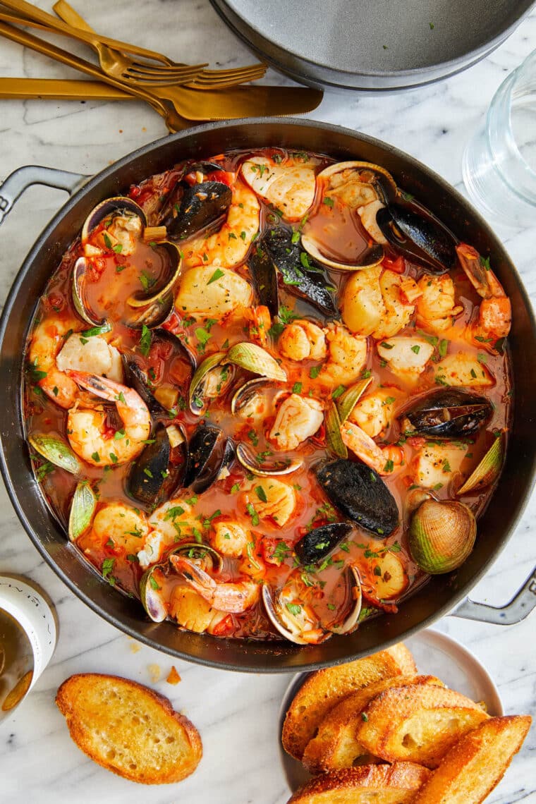 Easy Cioppino (Seafood Stew) - The BEST ever seafood stew, loaded with clams, mussels, cod, shrimp and scallops. So cozy, so hearty, so easy.