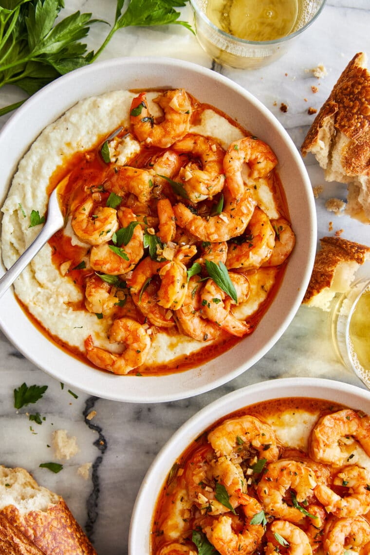 Garlic Butter Shrimp and Grits - Speedy comfort food at its best! Perfectly garlicky, buttery shrimp served with the creamiest grits!