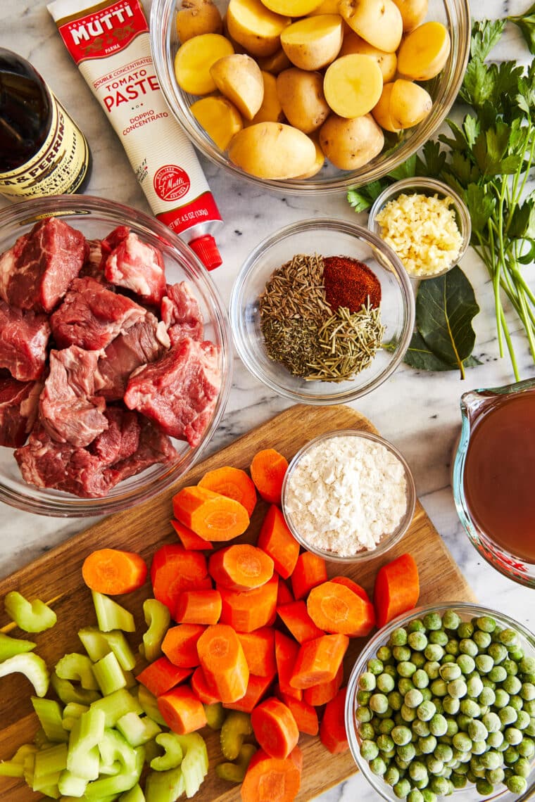 Instant Pot Beef Stew - Loaded with flavorful chunks of meat + potatoes that come out amazingly tender. Truly the BEST beef stew recipe ever!