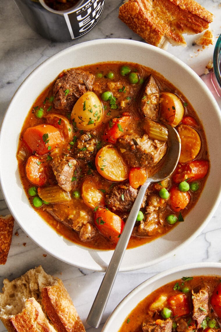 Instant Pot Beef Stew - Loaded with flavorful chunks of meat + potatoes that come out amazingly tender. Truly the BEST beef stew recipe ever!