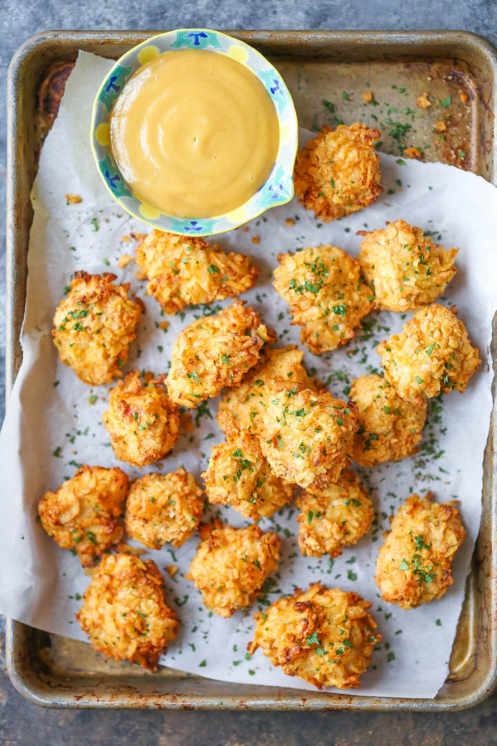 Baked Popcorn Chicken - A healthier alternative to the deep-fried version with the best crispy potato chip crust!! No one will believe that this is baked!