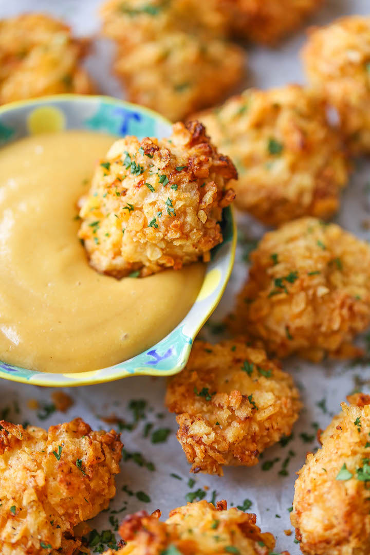 Baked Popcorn Chicken - A healthier alternative to the deep-fried version with the best crispy potato chip crust!! No one will believe that this is baked!