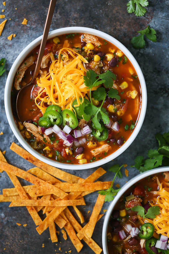 Chicken and Quinoa Tortilla Soup - Everyone's FAVORITE chicken tortilla soup, except made healthier and heartier with added quinoa. This cozy soup is full of fiber and protein to keep you full all day long! You can also add the easiest homemade crispy BAKED tortilla strips!