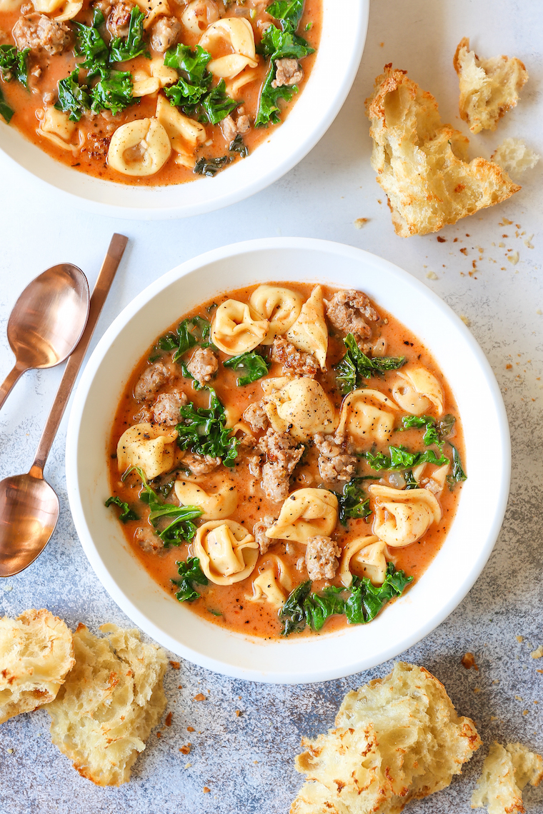 Creamy Tortellini Soup - My favorite cozy weeknight soup made in just 30 min! It's so stinking easy too. Loaded with tender tortellini, sausage and kale!