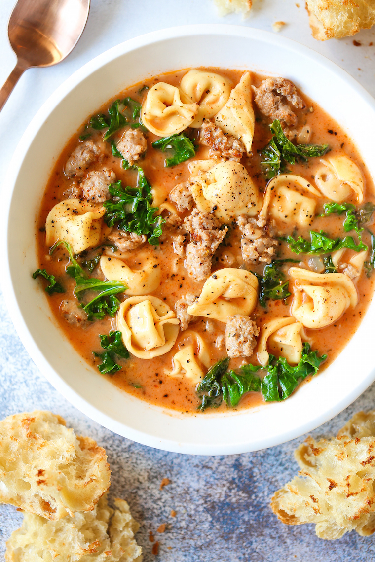 Creamy Tortellini Soup - My favorite cozy weeknight soup made in just 30 min! It's so stinking easy too. Loaded with tender tortellini, sausage and kale!