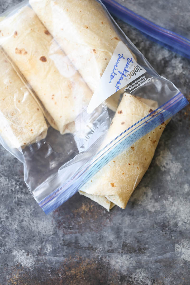 Freezer Breakfast Burritos - Meal prep over the weekend for the best burritos during the week. Loaded with tater tots, eggs, beans and cheese, of course!!