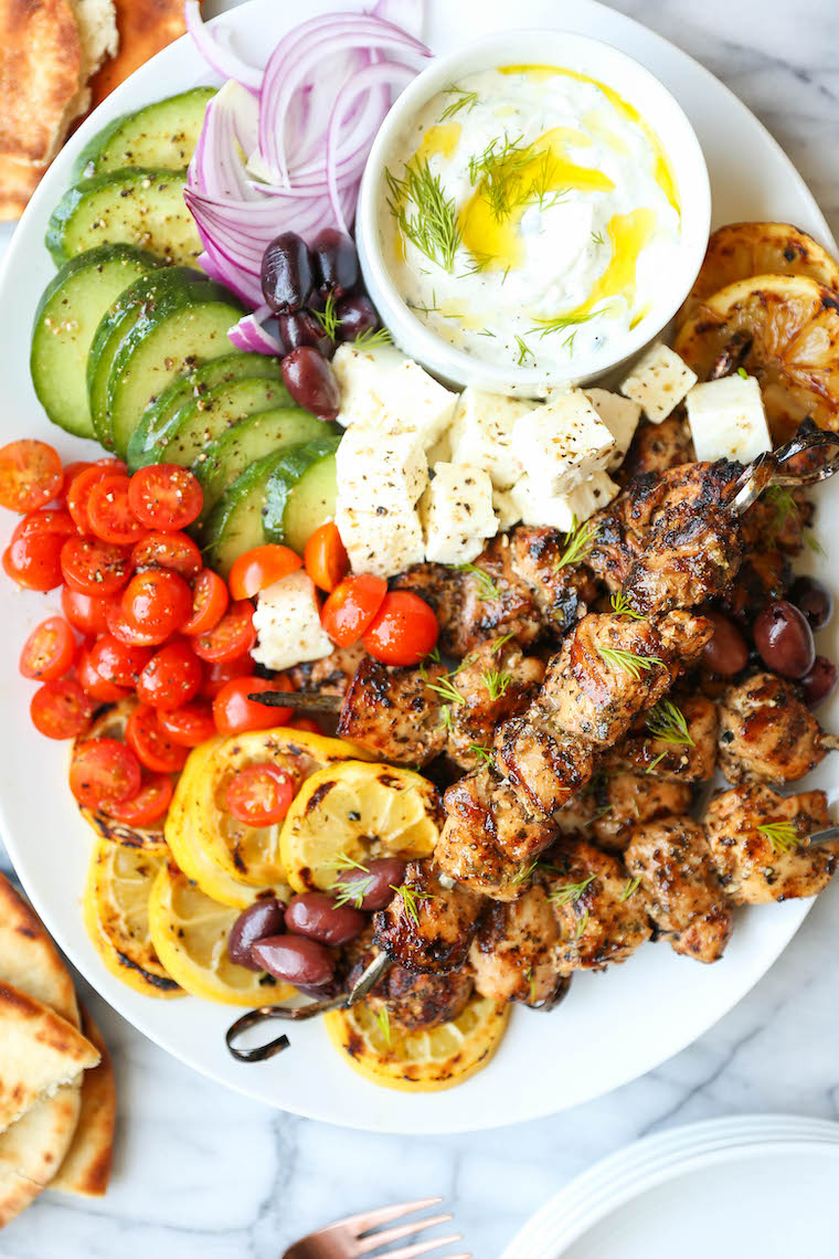 Greek Chicken Kabobs - Super juicy, tender kabobs made with the best marinade ever! Olive oil, lemon juice, paprika, oregano, basil, thyme, garlic. SO BOMB.