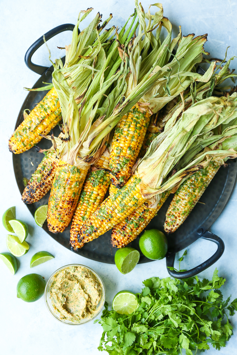 Grilled Corn with Cilantro Lime Butter - A SUMMER STAPLE! Butter, cilantro, garlic, lime, chili powder, and paprika. Option to grill or roast corn. SO GOOD!