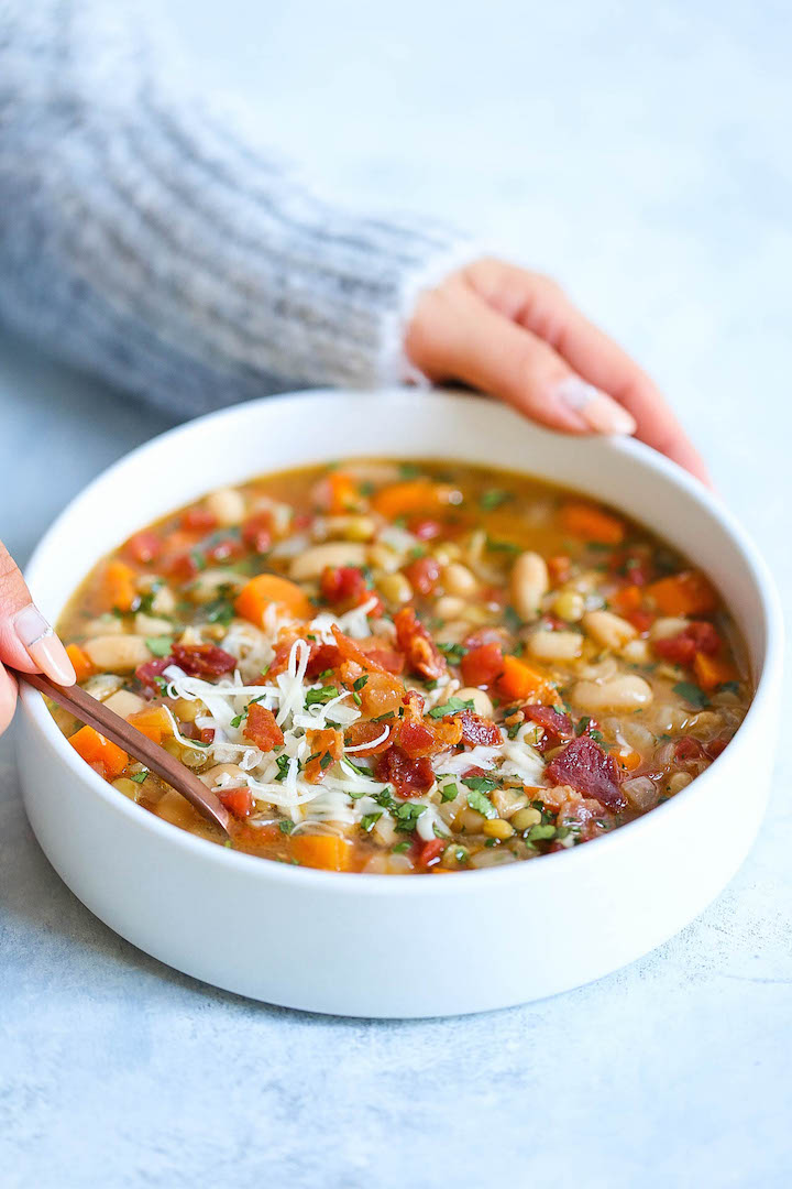 Hearty Lentil and White Bean Soup - So hearty, healthy and easy with just 213 calories per serving! You can also make this on any given weeknight, and the leftovers reheat very well! With the Parmesan rinds, this soup is bursting with just so much flavor!