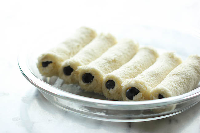 Blueberry French Toast Roll Ups - A fun twist on French toast stuffed with cream cheese and blueberries, tossed in cinnamon sugar goodness!