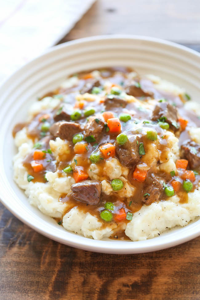 Irish Beef Stew - Amazingly slow-cooked tender beef with garlic mashed potatoes - comfort food at its best, and something you'll want all year long!