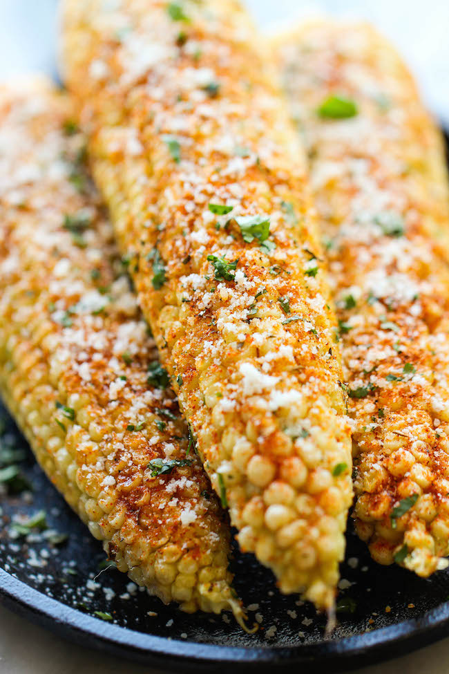 Mexican Corn on the Cob - This is the best way to serve corn, brushed with melted butter and sprinkled with chili powder, cheese and lime!