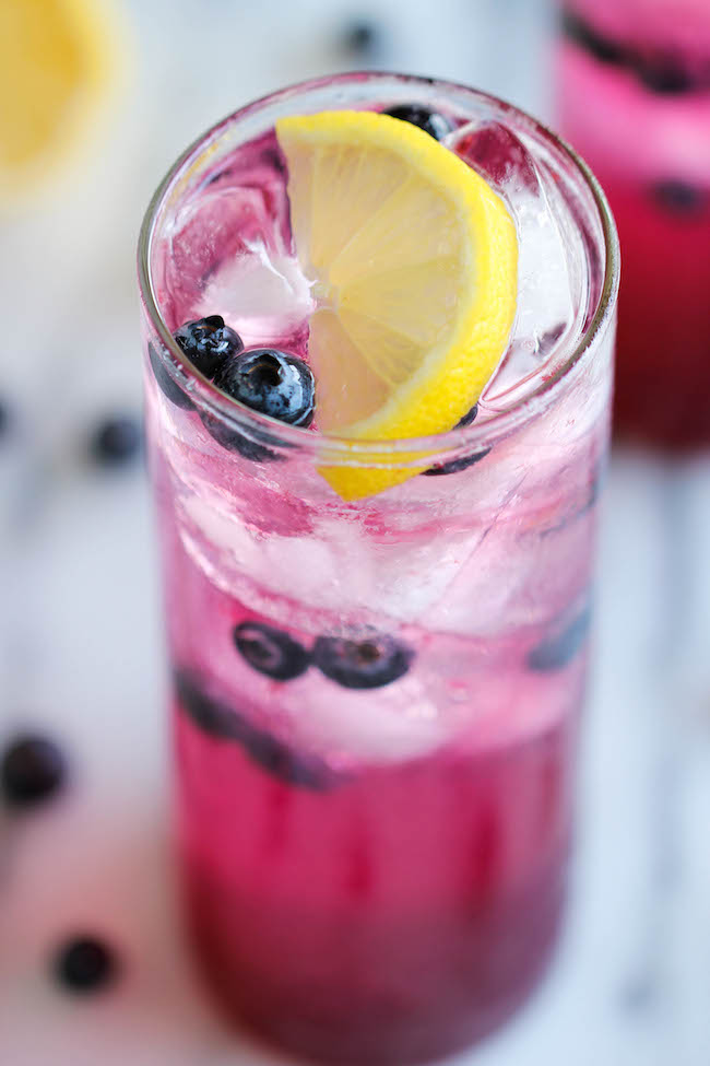 Blueberry Lemonade - Made with an easy blueberry syrup, this lemonade is so refreshing, sweet and tangy! It's the perfect way to cool down on a hot day!