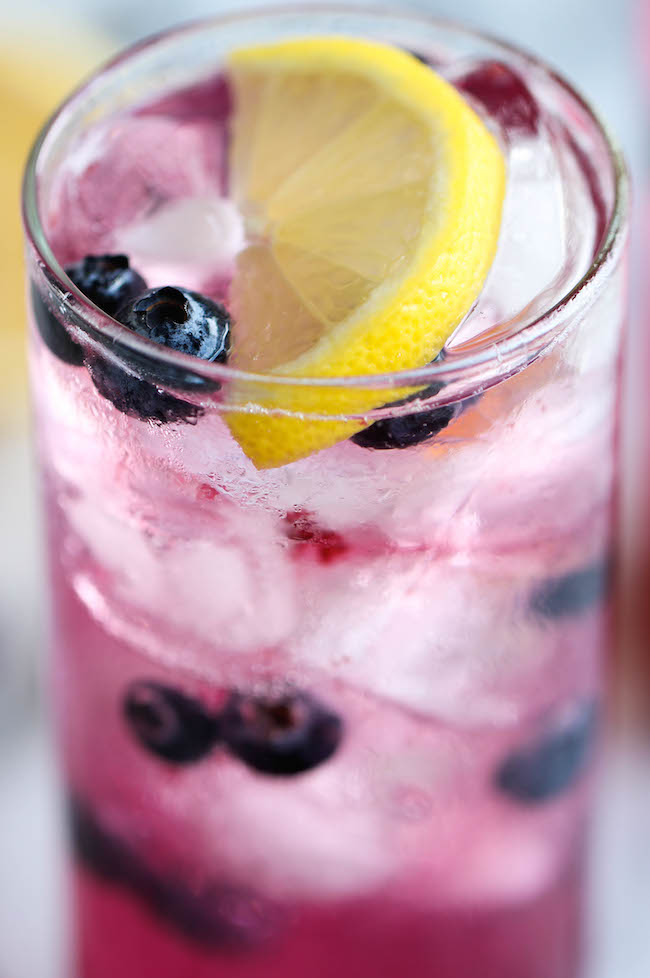 Blueberry Lemonade - Made with an easy blueberry syrup, this lemonade is so refreshing, sweet and tangy! It's the perfect way to cool down on a hot day!