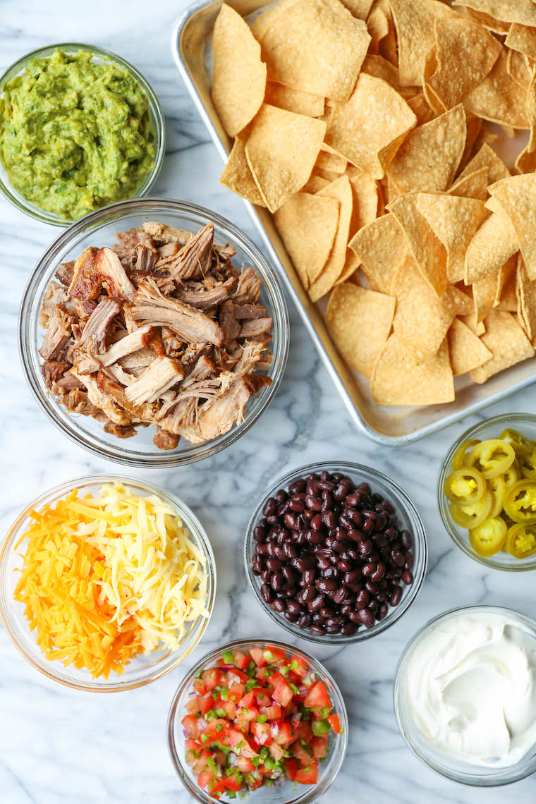 Instant Pot Pulled Pork Nachos - Crowd-pleasing, fully-loaded nachos with the most amazing melt-in-your-mouth, juicy shredded pork. So tender, so good!