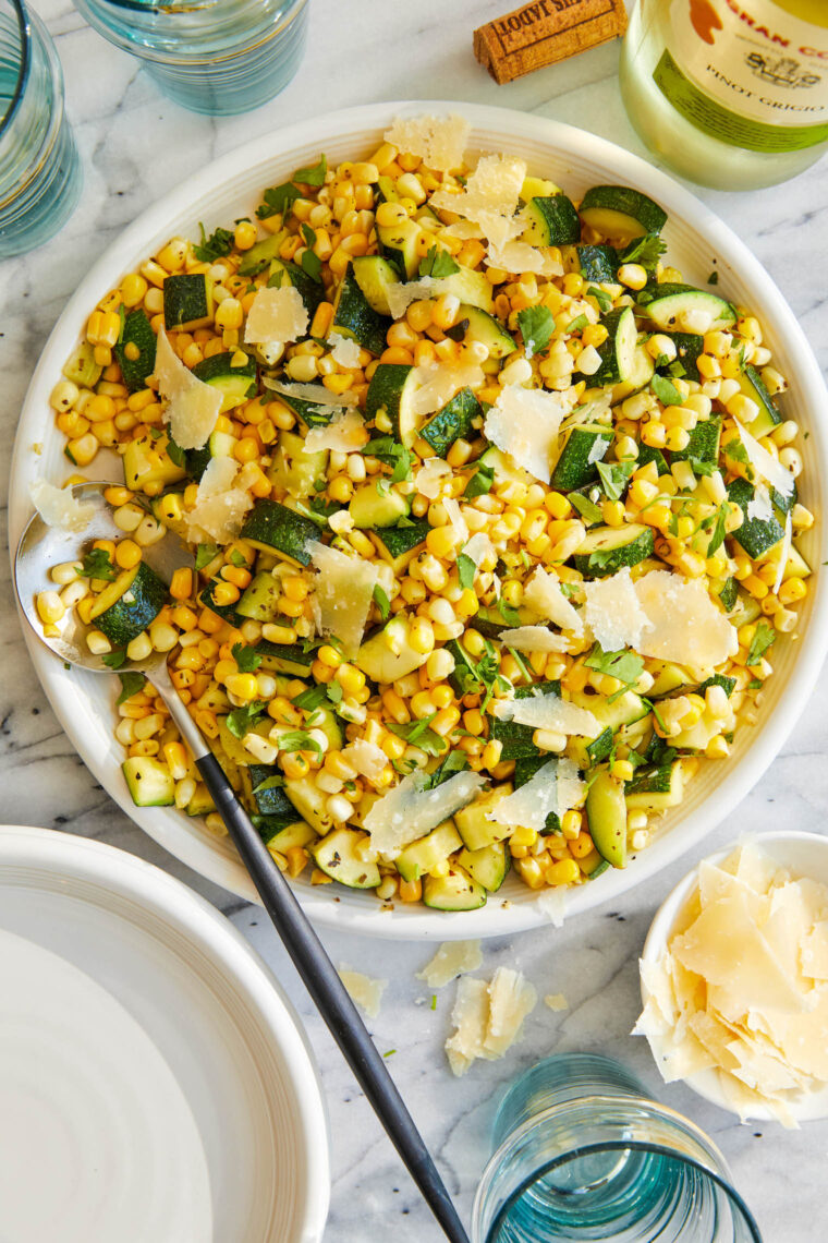 Parmesan Zucchini and Corn - A healthy 10 minute zucchini side dish to dress up any meal. It's so simple yet full of flavor! SO SO GOOD.