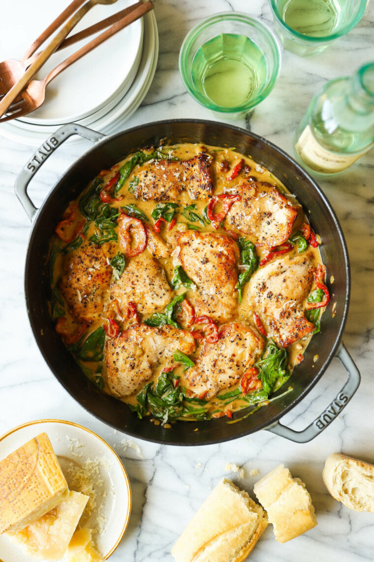 Skillet Sun Dried Tomato Chicken Thighs - Juicy, golden brown chicken in the sauciest, sun dried tomato cream sauce with sneaked-in greens!