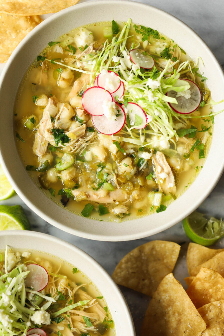 Slow Cooker Chicken Posole - Made so easily right in your crockpot! Loaded with shredded chicken, hominy and green chiles. So cozy, so good.